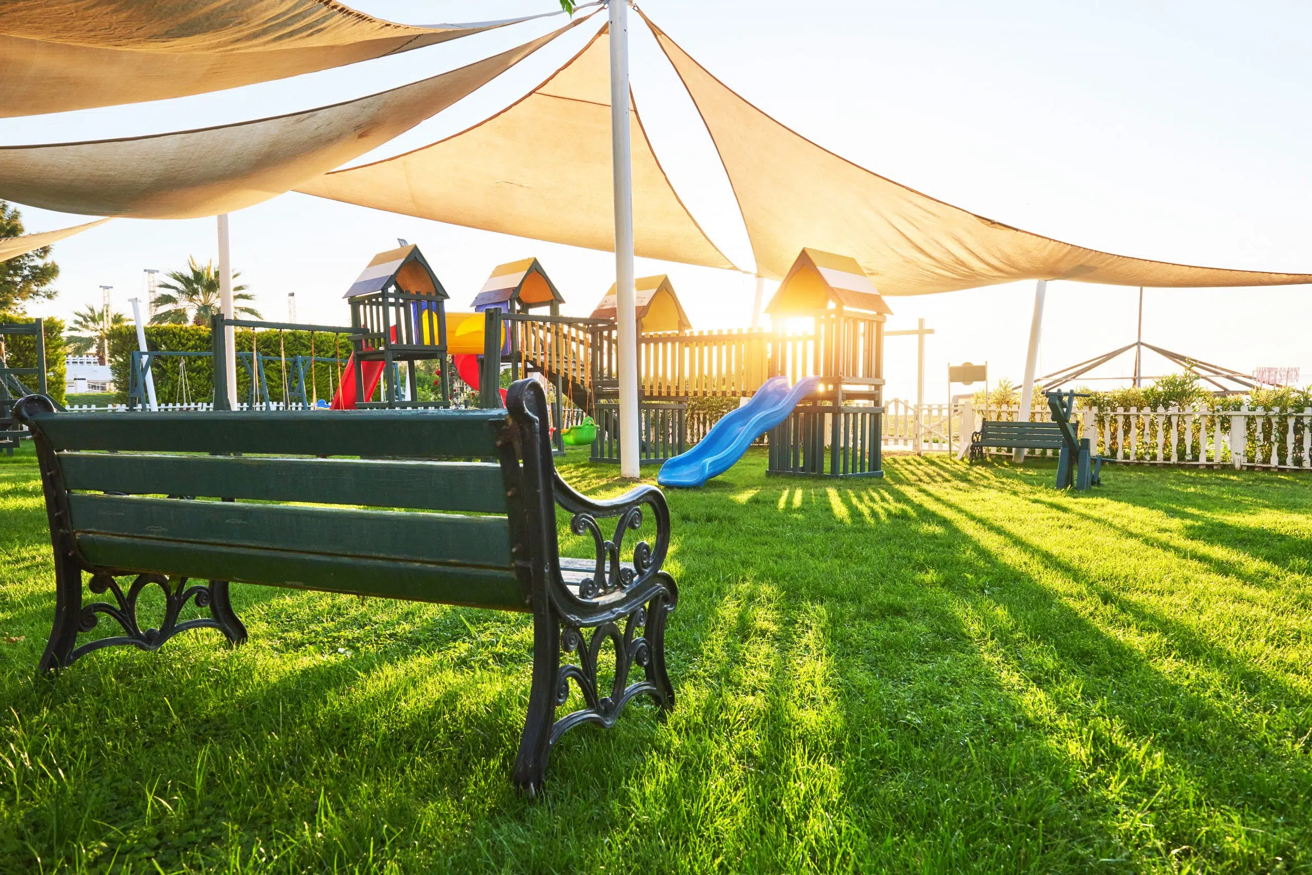 colorful playground in the yard in the park at sun 2021 08 29 13 10 42 utc scaled 1