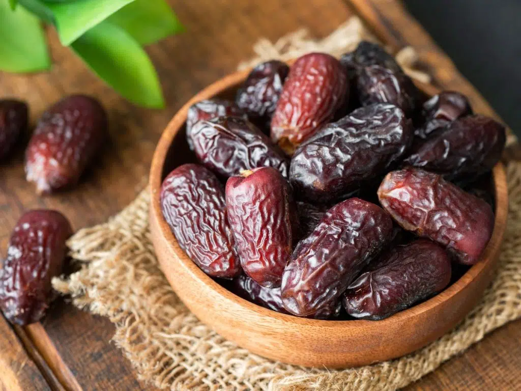 dried dates in wooden bowl royalty free image 1640107942