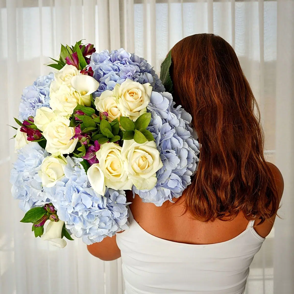 Flowers in a bouquet by Alissar Flowers Doha